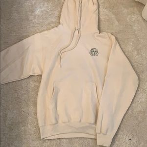 Cream hoodie with green detailing